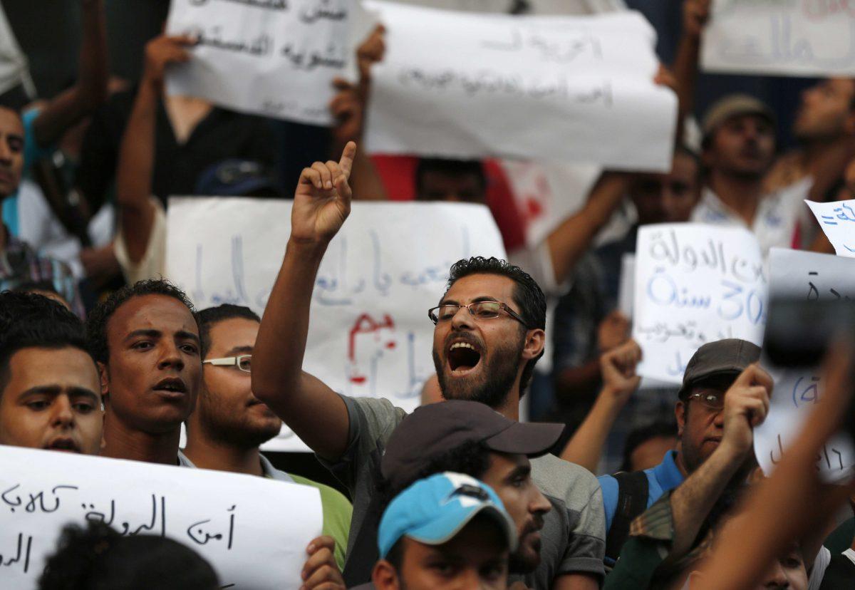 Demonstrators chant slogans during a protest against ousted President Hosni Mubarak&#8217;s release from prison, in Cairo, Egypt, Wednesday, Aug. 28, 2013. Mubarak has been in detention since April 2011. He was found guilty and sentenced to life in prison last year for failing to stop the killing of some 900 protesters in the 18-day 2011 uprising, but his sentence was overturned on appeal. In April, his retrial opened along with those of his security chief and six top police commanders. His trial has been postponed to Sept. 14. (AP Photo/Lefteris Pitarakis)