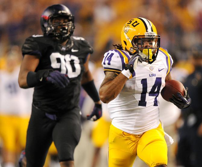 LSU junior running back Terrence Magee (14) scores a 52-yard touchdown Aug. 31, 2013 during the 37-27 victory against TCU in the Cowboys Classic at AT&amp;T Stadium in Arlington, Texas.