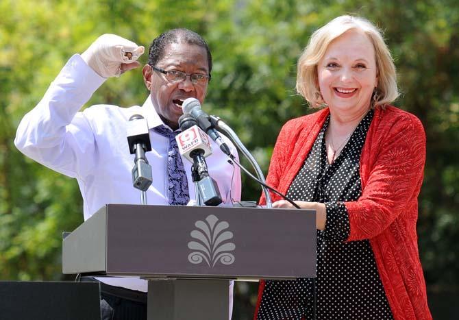 Baton Rouge Mayor-President Kip Holden (left) and Marmillion/Gray Media president Rannah Gray (right) announced the addition of Red Stick Revelry, a New Year's Eve celebration, on August 28, 2013, at a news conference in Town Square. The event will include a countdown to midnight with the descent of a red stick sculpture along with live entertainment.