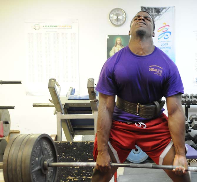 Former LSU powerlifter, Garrett Bailey, deadlifts at Fletchers House of Power Monday, August 26, 2013 while he trains for upcoming competitions