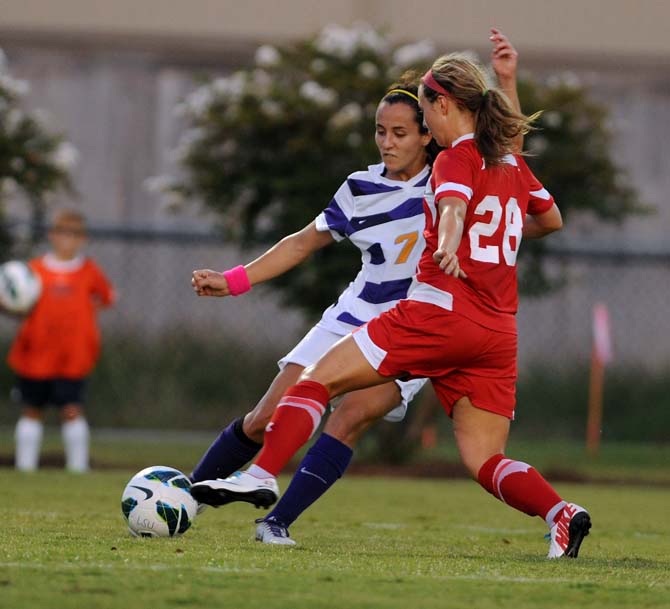 LSU sophomore midfielder Fernanda Pina tries to reclaim the ball from an opponent on August 23, 2013 during the LSU vs. Louisiana Tech soccer game in the LSU soccer stadium.