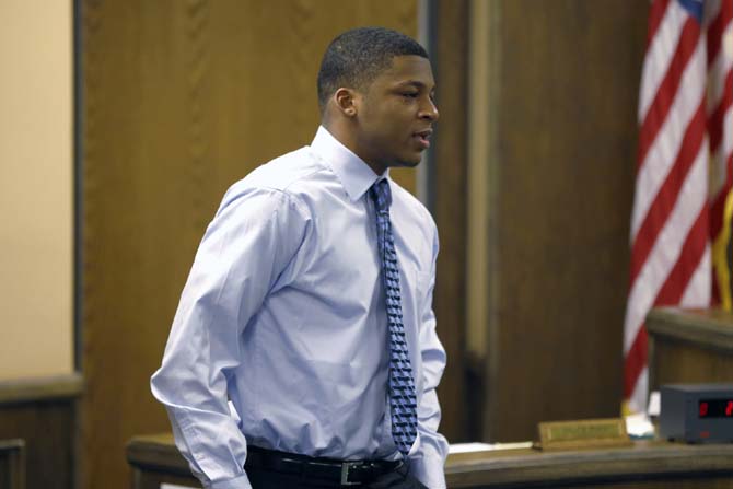 In this March 17, 2013 photo, Ma'Lik Richmond walks towards the victim and her family to apologize after he and co-defendant Trent Mays were found delinquent on rape and other charges after their trial in juvenile court in Steubenville, Ohio. A judge has scheduled a hearing to determine the sex offender classification for Ma'Lik Richmond a high school football player convicted of raping a 16-year-old girl last year.(AP Photo/Keith Srakocic, Pool, File)