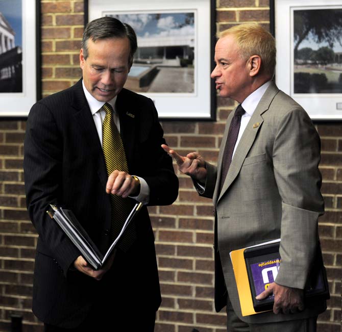 LSU System President F. King Alexander goes through notes following a Board of Supervisors meeting on July 26, 2013 in the LSU System Building.