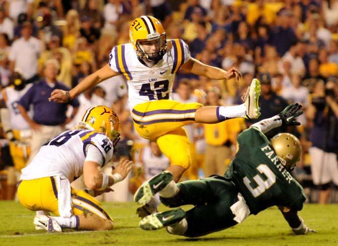 LSU freshman place kicker Colby Delahoussaye kicks an extra point field goal Sept. 7, 2013 during the 56-17 victory against UAB in Tiger Stadium.