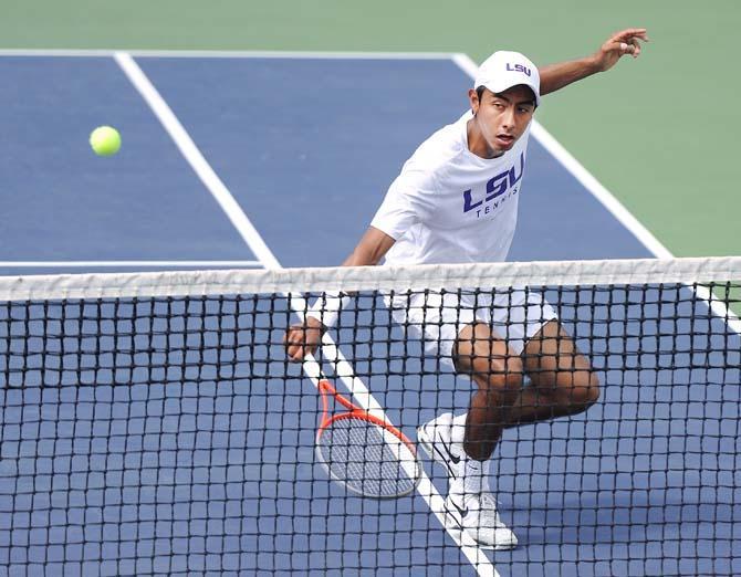 LSU freshman Boris Arias hits the ball April 10, 2013, during a match against Mississippi State at the W.T. "Dub" Robinson Stadium.