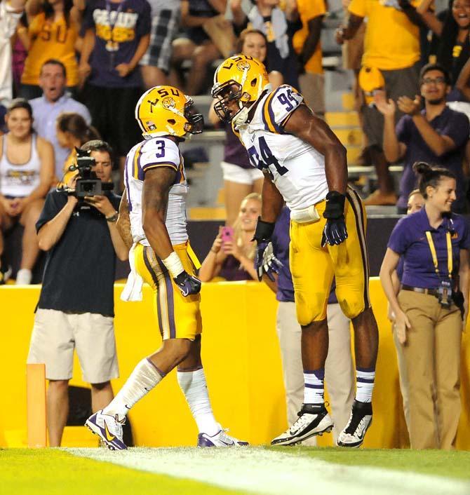 Jr., Wide Reciever, Odell Beckham Jr., celebrates with Soph., Defensive End, Danielle Hunter, Sept. 7, 2013 after a touchdown against UAB in Tiger Stadium