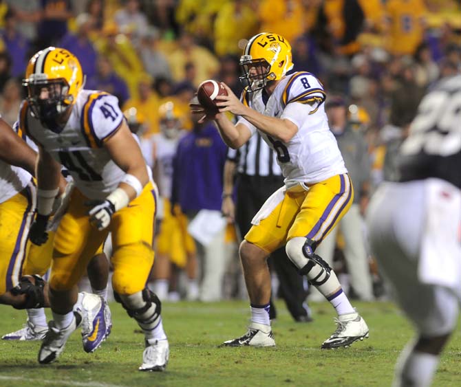 LSU senior quarterback Zach Mettenberger (8) takes a snap Saturday, September 21, 2013, during the Tigers' 35-21 victory against Auburn in Tiger Stadium.