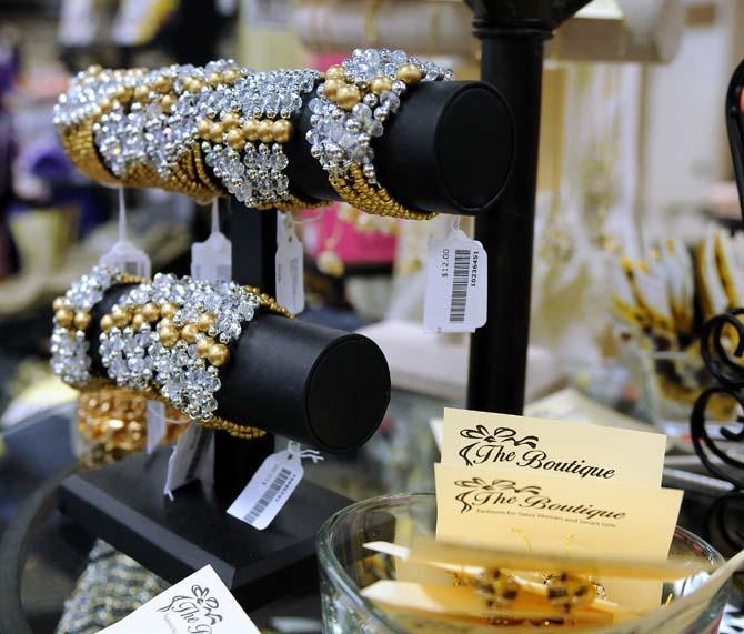 Bracelets are displayed on a rack Friday, August 30, 2013 at The Boutique, a local clothing and accessory store owned by Tammy Jones.