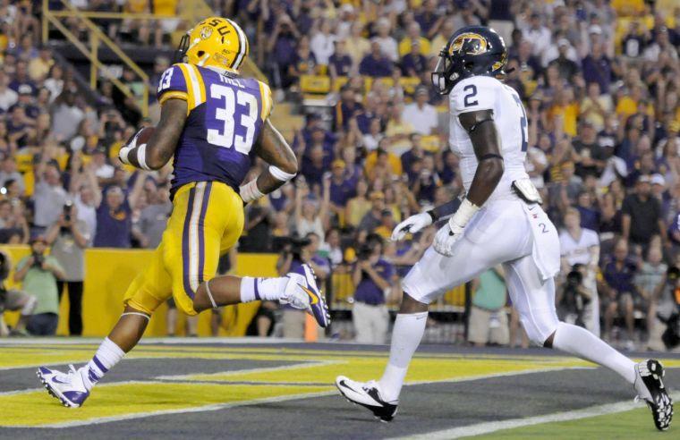 LSU sophomore running back Jeremy Hill (33) runs the ball into the endzone Saturday night, Sept. 14, 2013, in the Tigers' 45-13 victory against Kent State.