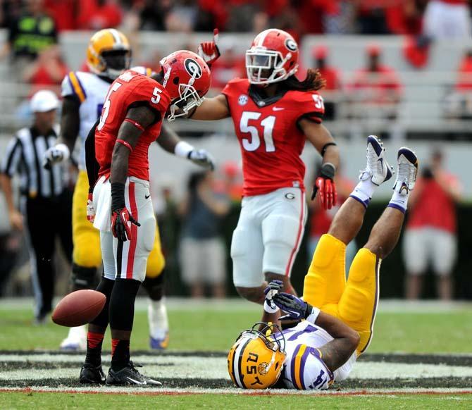 LSU junior running back Terrence Magee (14) falls to the ground after a play Saturday, Sept 28, 2013 during The Bulldogs' 44-41 victory against the Tigers in Sanford Stadium.