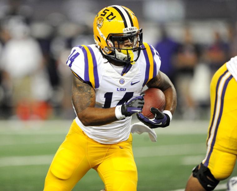 LSU junior running back Terrence Magee (14) maneuvers downfield Saturday, August 31, 2013 during the Tigers' 32-27 victory against TCU in the 2013 Cowboys Classic at AT&amp;T Stadium in Arlington, Texas.