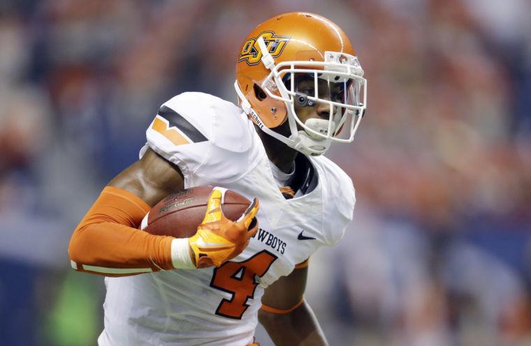 Oklahoma State's Justin Gilbert returns a kick off against Texas San Antonio during the first half of an NCAA college football game, Saturday, Sept. 7, 2013, in San Antonio.