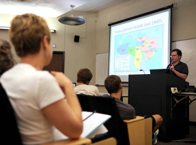 LSU students and fellow faculty gather Mon. Sept. 9, 2013 in Howe Russell Hall to discuss the U.S. involvement in Syria with Leonard Ray, a University political science associate professor.