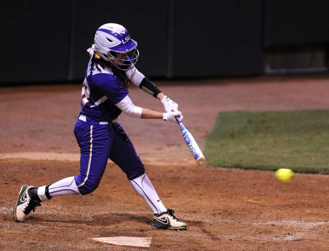 LSU senior infielder Allison Falcon (32) slams the ball on Monday September 30, 2013 during the LSU vs. USSSA Florida Pride 11-0 loss in Tiger Park.