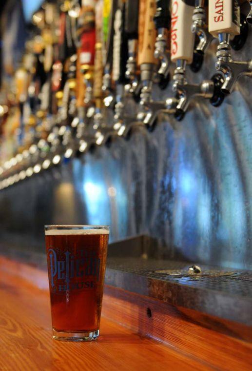 A freshly poured glass of Wasatch pumpkin beer sits on the counter on Monday September 30, 2013 in the Pelican House bar.