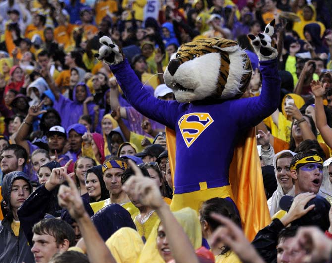 Mike the Tiger cheers on the team with the student section Saturday, September 21, 2013, during the Tigers' 35-21 victory against Auburn in Tiger Stadium.