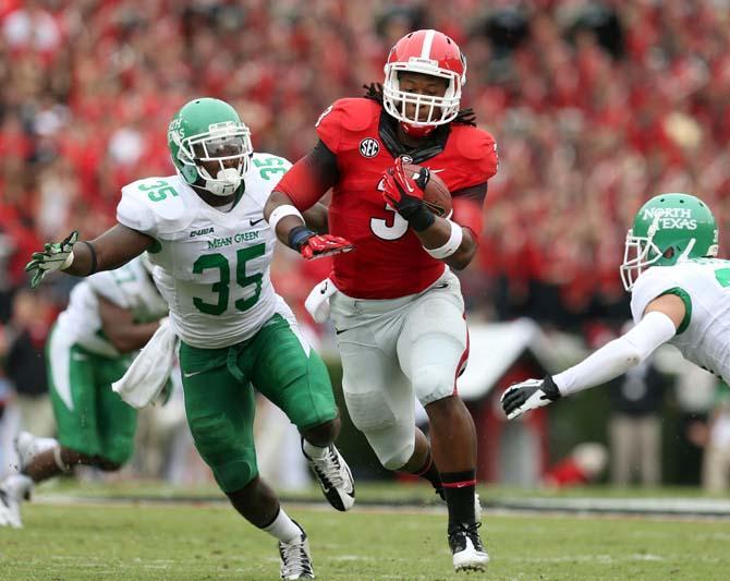 Georgia tailback Todd Gurley (3) runs past North Texas linebacker Zach Orr (35) for a first down in the second half of an NCAA college football game at Sanford Stadium Saturday, Sept. 21, 2013, in Athens, Ga. (AP Photo/Atlanta Journal-Constitution, Jason Getz ) MARIETTA DAILY OUT; GWINNETT DAILY POST OUT; LOCAL TV OUT; WXIA-TV OUT; WGCL-TV OUT