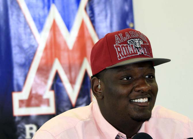 West Monroe High School football player Cameron Robinson, a top prospect as an offensive lineman, smiles during a news conference, Wednesday, Sept. 4, 2013, in West Monroe, La., where he announced his verbal commitment to attend the University of Alabama. (AP Photo/The News-Star, Margaret Croft) NO SALES