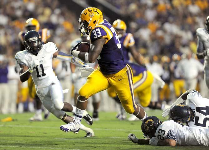 LSU sophomore running back Jeremy Hill scores a touchdown Saturday, Sept. 14, 2013 during the Tiger's 45-13 victory in Tiger Stadium