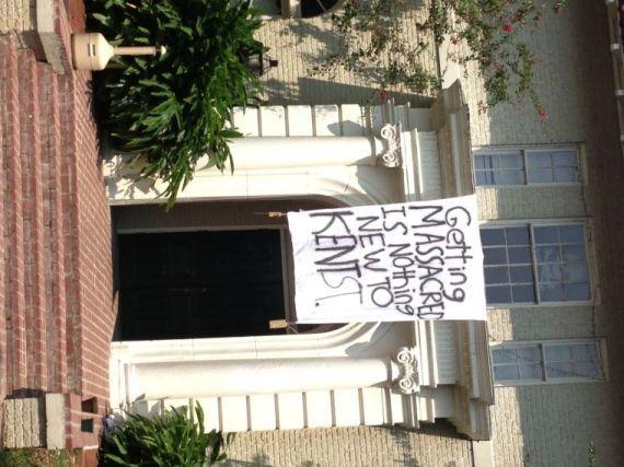 A sign outside the DKE fraternity house on Saturday reads "Getting massacred is nothing new to Kent St."&#160;