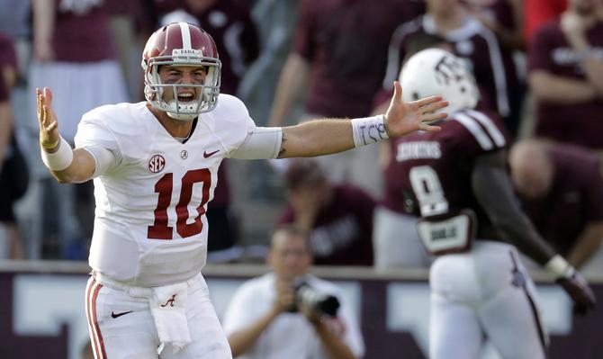 Alabama quarterback AJ McCarron (10) celebrates after throwing a touchdown pass to Jalston Fowler during the fourth quarter of an NCAA college football game against Texas A&amp;M Saturday, Sept. 14, 2013, in College Station, Texas. Alabama won 49-42. (AP Photo/David J. Phillip)