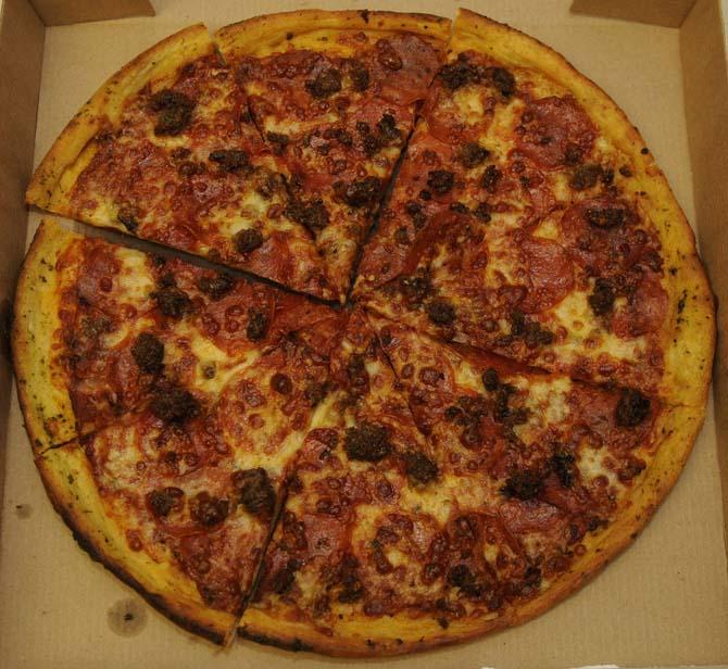 Oscar's Pizza Joint's pepperoni and sausage 14' pizza