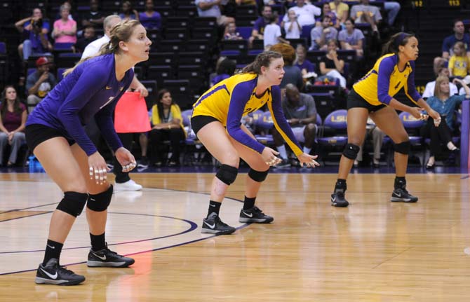 Sophomore, Katie Lindelow (7), Sophomore, Cati Leak (24), and Sophomore, Khourtni Fears (1) stand ready Friday Aug. 30, 2013 against the Tigers match series against Texas San Antonio.