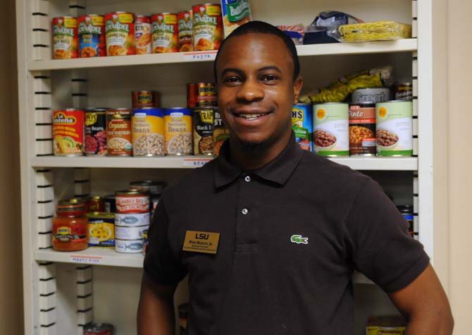 Graduate assistant Mike Mosley, Jr. stands in front of the LSU food pantry on Thursday, September 19, 2013 in the Union.