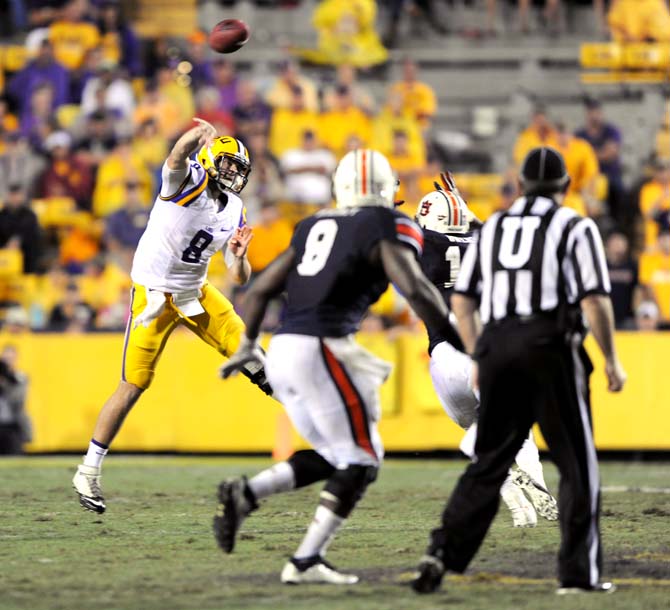 LSU senior quarterback Zach Mettenberger (8) throws the football downfield Saturday, Sept. 21, 2013 during the Tigers' 35-21 victory against Auburn in Tiger Stadium.