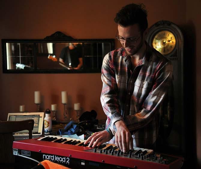 Andrew Callaway, one half of England in 1819, plays synthesizer at their practice space Monday, Sept. 16, 2013 as the band rehearses for their upcoming tour.