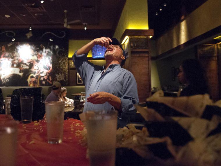 Bob Kuhns relishes in eating the dregs of his tot basket after he won first place in the solo division of Rock The Tot on Thursday, Sept. 19, 2013 at Bar Louie.