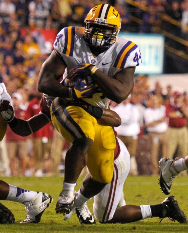 LSU junior fullback J.C. Copeland (44) fights for extra yardage Saturday, Nov. 3, 2012, during the Tigers' 21-17 loss to Alabama in Tiger Stadium.