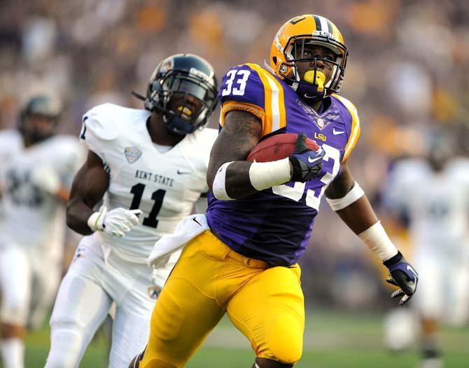 LSU sophomore running back Jeremy Hill (33) runs into the endzone to score the Tigers' first touchdown against Kent State in Tiger Stadium.