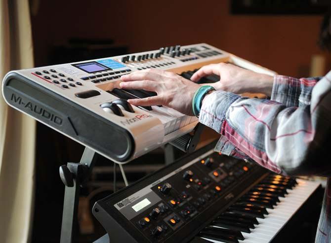 Andrew Callaway, one half of England in 1819, plays synthesizer at their practice space Monday, Sept. 16, 2013 as the band rehearses for their upcoming tour.