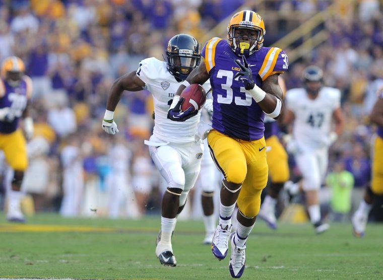 LSU sophomore running back Jeremy Hill (33) carries the ball down field Saturday night, Sept. 14, 2013, in the Tigers' 45-13 victory against Kent State.