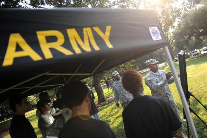 Sgt. Travis Cox explains a battle line Sept. 13, 2013 to a group of Army Future Soldiers at BREC City-Brooks Community Park.