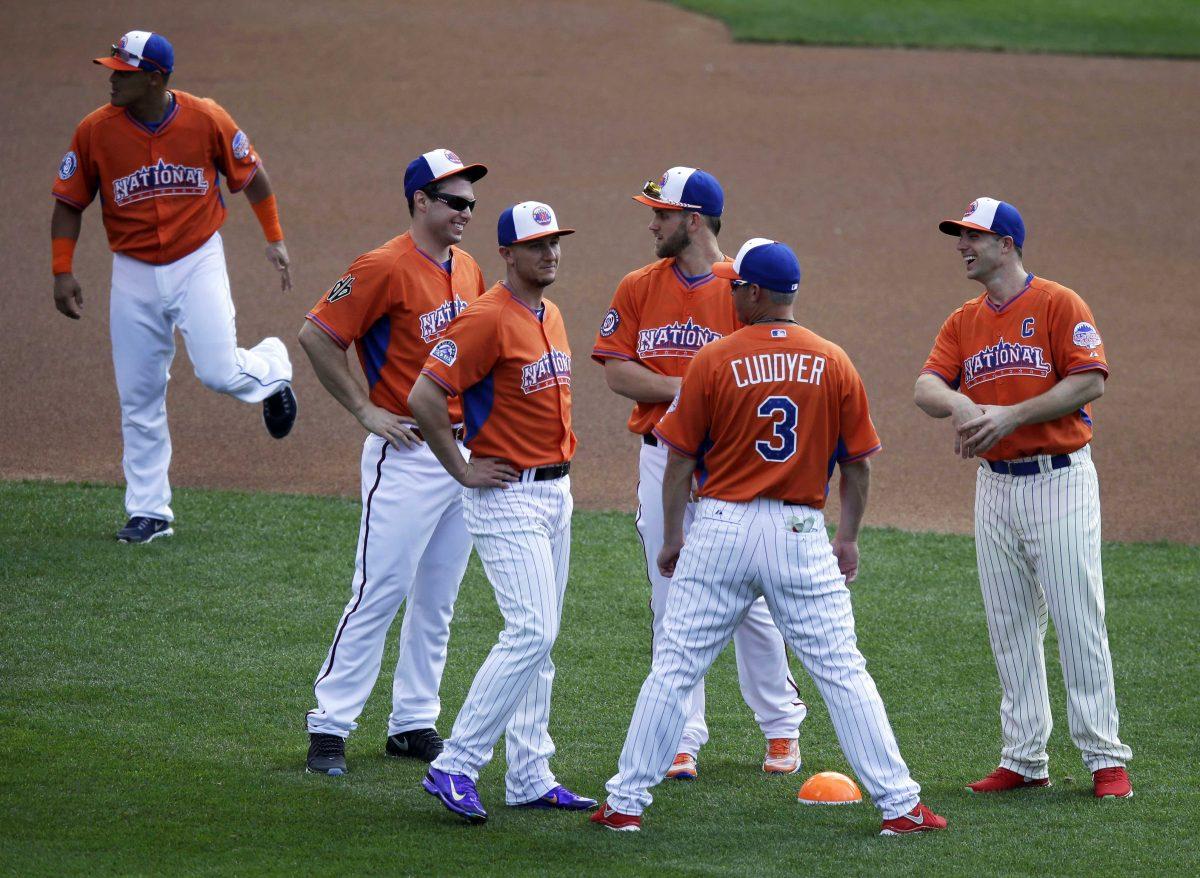 National League captain David Wright, right, speaks with teammates including Michael Cuddyer, second from right, and Bryce Harper, third from right, during batting practice for the MLB All-Star baseball game, on Monday, July 15, 2013, in New York. (AP Photo/Kathy Willens)