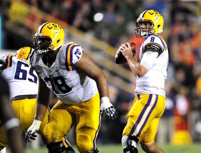 LSU senior quarterback Zach Mettenberger (8) looks downfield for a receiver Saturday, Sept. 21, 2013 during the Tigers' 35-21 victory against Auburn in Tiger Stadium.