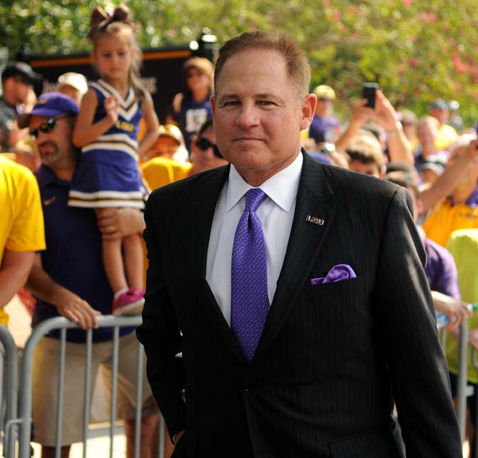 LSU head football coach Les Miles waits for his team to walk down Victory Hill on Sept. 7, 2013 before the 56-17 victory against UAB in Tiger Stadium.