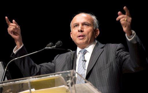 In this April 11, 2013 photo Fairfax Financial Chairman and CEO Prem Watsa speaks at the company's annual general meeting in Toronto. Watsa on Wednesday, Sept. 25, 2013 said he has every intention of completing the acquisition of BlackBerry, despite doubts that the $4.7 billion deal for the troubled smartphone maker will go through. (AP Photo/The Canadian Press, Frank Gunn)