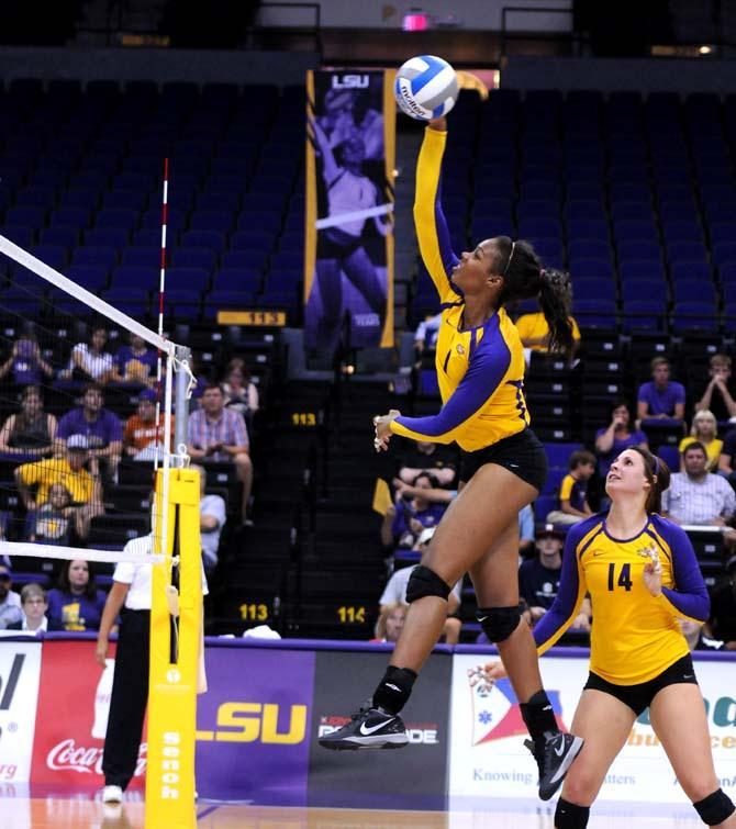 Sophomore, Khourtni Fears (1), and Junior, Malorie Pardo (14) volley Friday Aug. 30, 2013 against Texas San-Antonio in their 3-1 victory