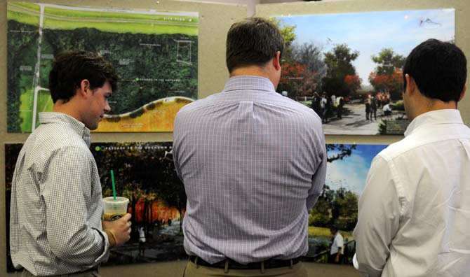 Spectators look over the designs that are in the running for the Battle of New Orleans Monument on Friday, Sept. 27, 2013 at the LSU Design Building.