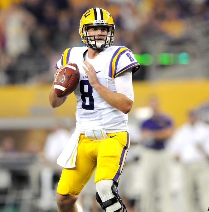 LSU senior quarterback Zach Mettenberger (8) looks downfield for a receiver Saturday, August 31, 2013 during the Tigers' 32-27 victory against TCU in the 2013 Cowboys Classic at AT&amp;T Stadium in Arlington, Texas.