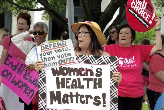 People gather outside the state legislature as Senate Republicans gave their final approval to legislation requiring additional rules surrounding abortions in North Carolina, even as hundreds of protesters against the bill watched from the gallery Wednesday in Raleigh.