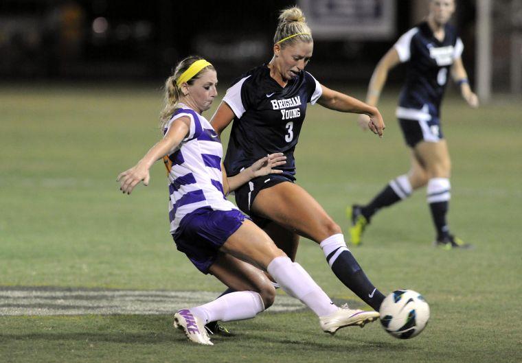 LSU senior defender Alex Ramsey (15) fights BYU sophomore defender Paige Hunt (3) for control of the ball Monday, Sept. 2, 2013, at the LSU Soccer Stadium.