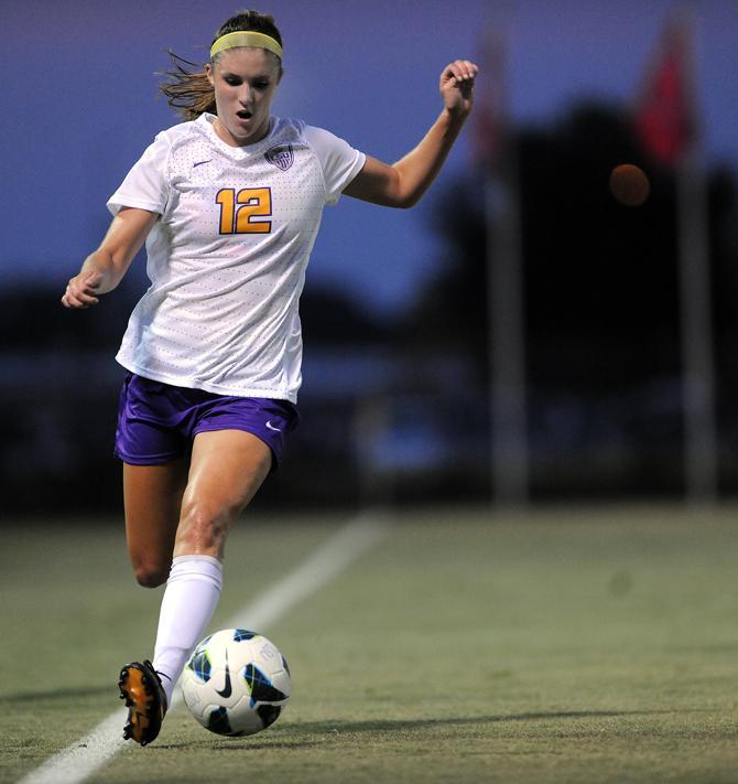 LSU sophomore midfielder Heather Magee (12) drives the ball down the field Aug. 27, 2013 during the Tigers' 6-0 victory over the Warhawks at the LSU Soccer Stadium.