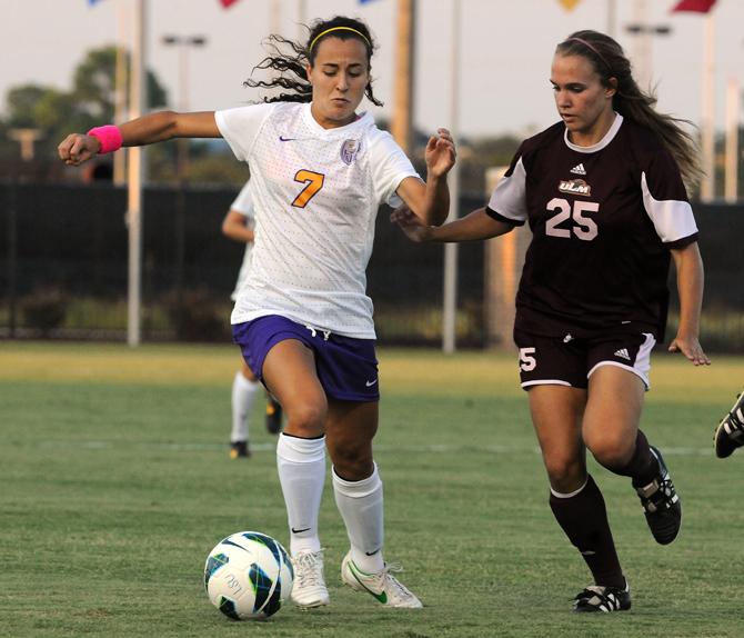 LSU sophomore midfielder Fernanda Pina (7) battles with University of Louisiana-Monroe freshman midfielder Mary Ashton Lembo (25) on Aug. 27, 2013 during the Tigers' 6-0 victory over the Warhawks at the LSU Soccer Stadium.