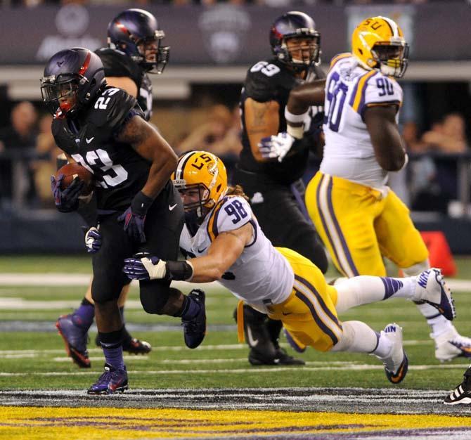 LSU junior defensive end Jordan Allen (98) tackles TCU aophomore tail back B.J. Catalon (23) Aug. 31, 2013 during the 37-27 victory against the Horned Frogs in the Cowboys Classic at AT&amp;T Stadium in Arlington, Texas.