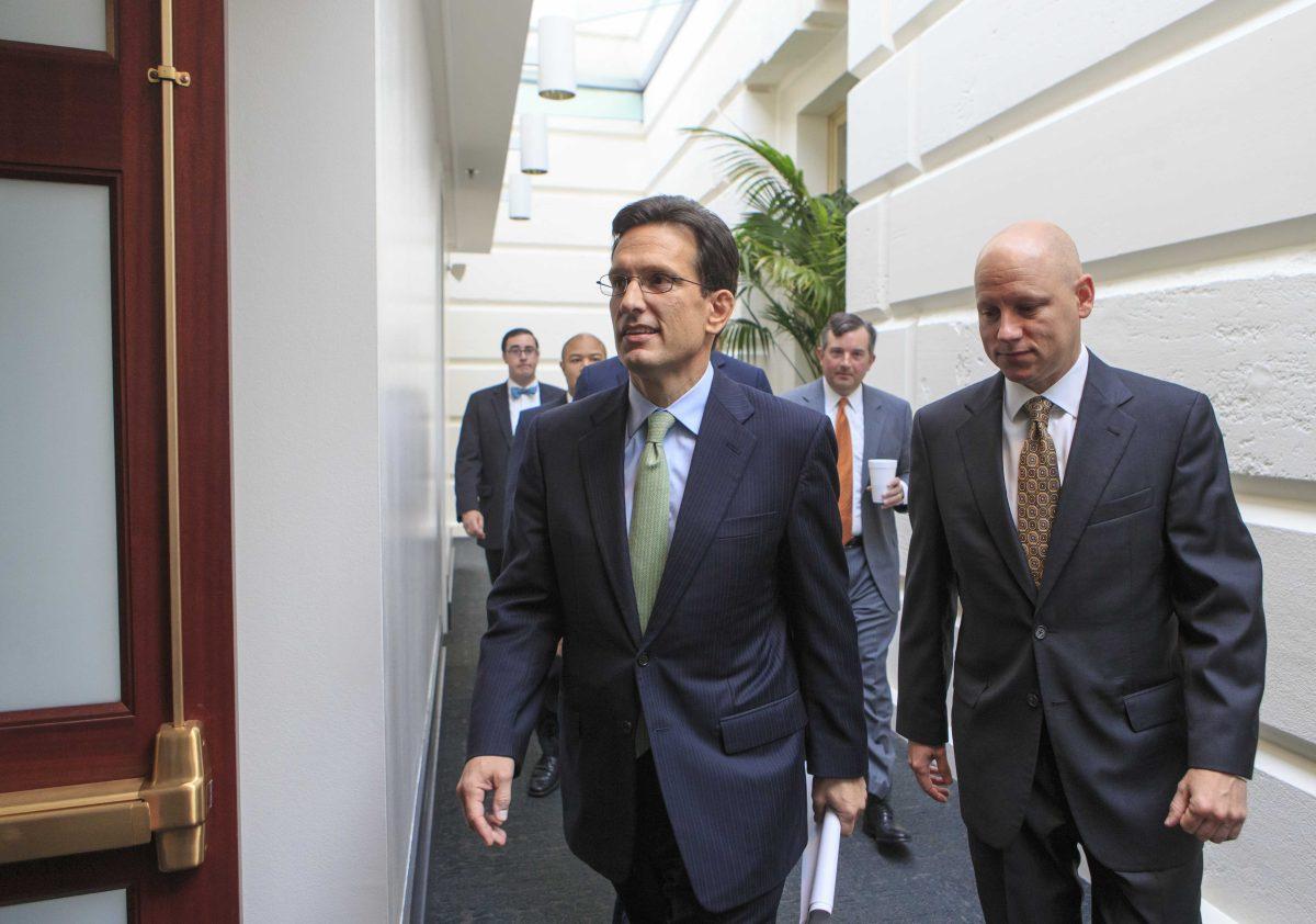 In this Sept. 10, 2013, photo, House Majority Leader Eric Cantor, R-Va., walks to a Republican strategy session at the Capitol, in Washington. A revolt by tea party conservatives forced House GOP leaders on Wednesday, Sept. 11, to delay a vote on a temporary spending bill required to prevent a government shutdown next month. The plan by top Republicans like Cantor is designed to keep government agencies running through Dec. 15. Cantor's office announced the delay. (AP Photo/J. Scott Applewhite)