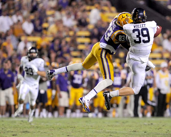 LSU freshman wide receiver Travin Dural jumps for pass with Kent St. senior safety Luke Wollet Saturday, Sept. 14, 2013 during the Tiger's 45-13 victory in Tiger Stadium